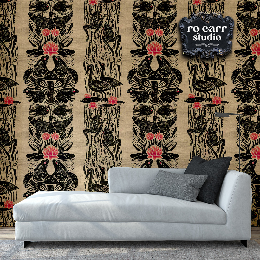 Photo of interior scene with light gray chaise lounge in foreground and wallpapered wall in beige, black and pink.