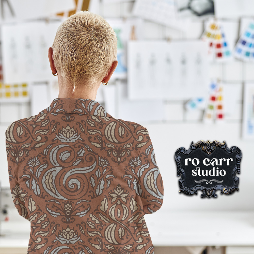 Woman wearing denim jacket printed in repeating ampersand pattern.