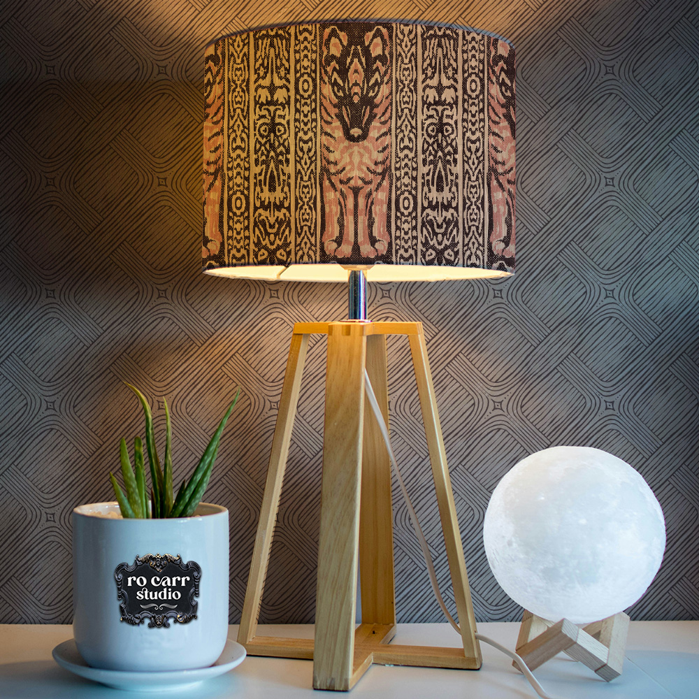 Lampshade printed with Lupo & Owl design, with wallpaper featuring basketweave in natural.