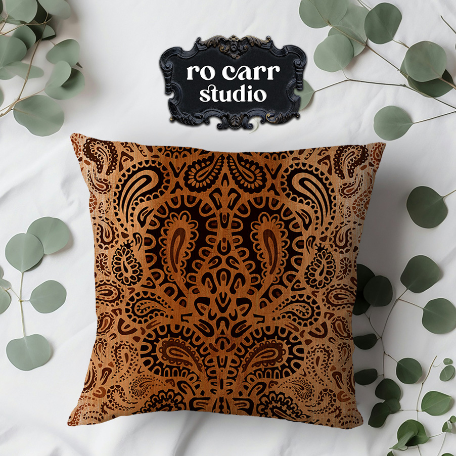 Leopard paisley pattern printed on a decorative throw pillow.