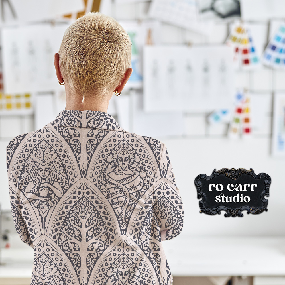 Mockup of woman wearing a fabric jacket printed with A Gothic Love Story pattern.