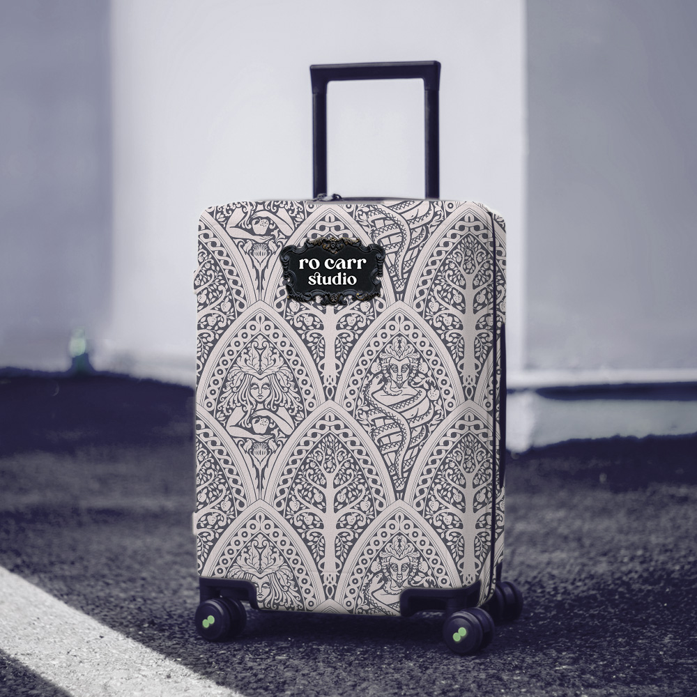 A Gothic Love Story pattern printed on a rolling suitcase.