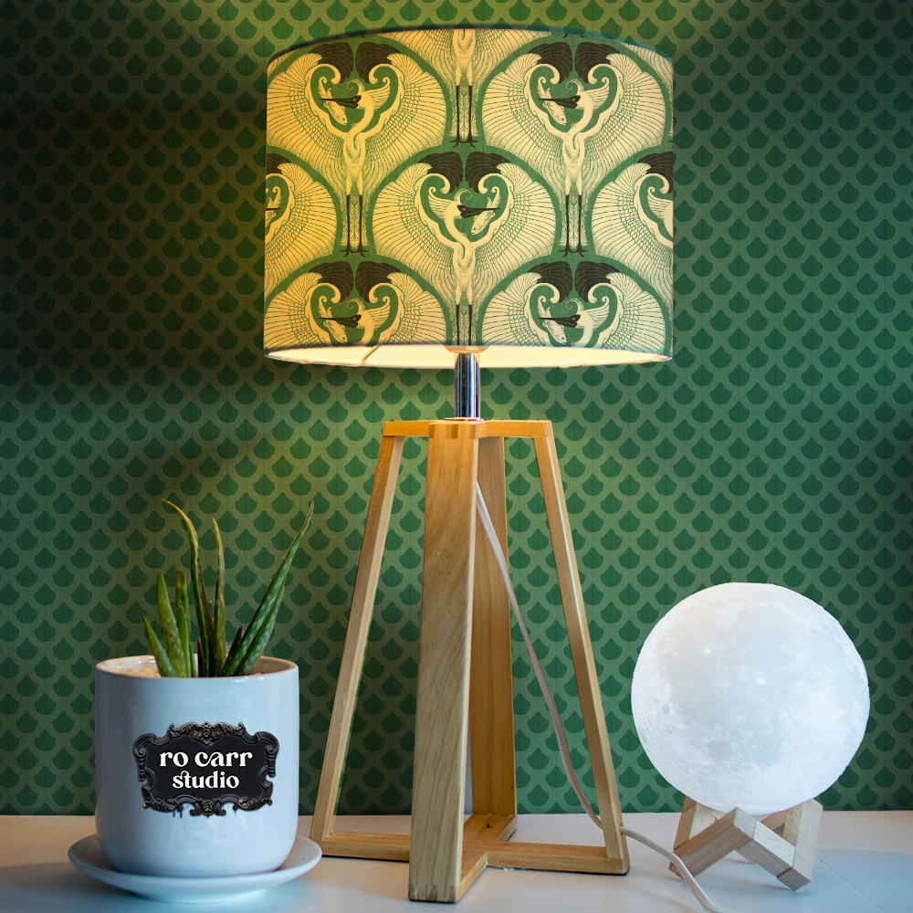 Mockup of lamp shade printed with the great egret pattern.