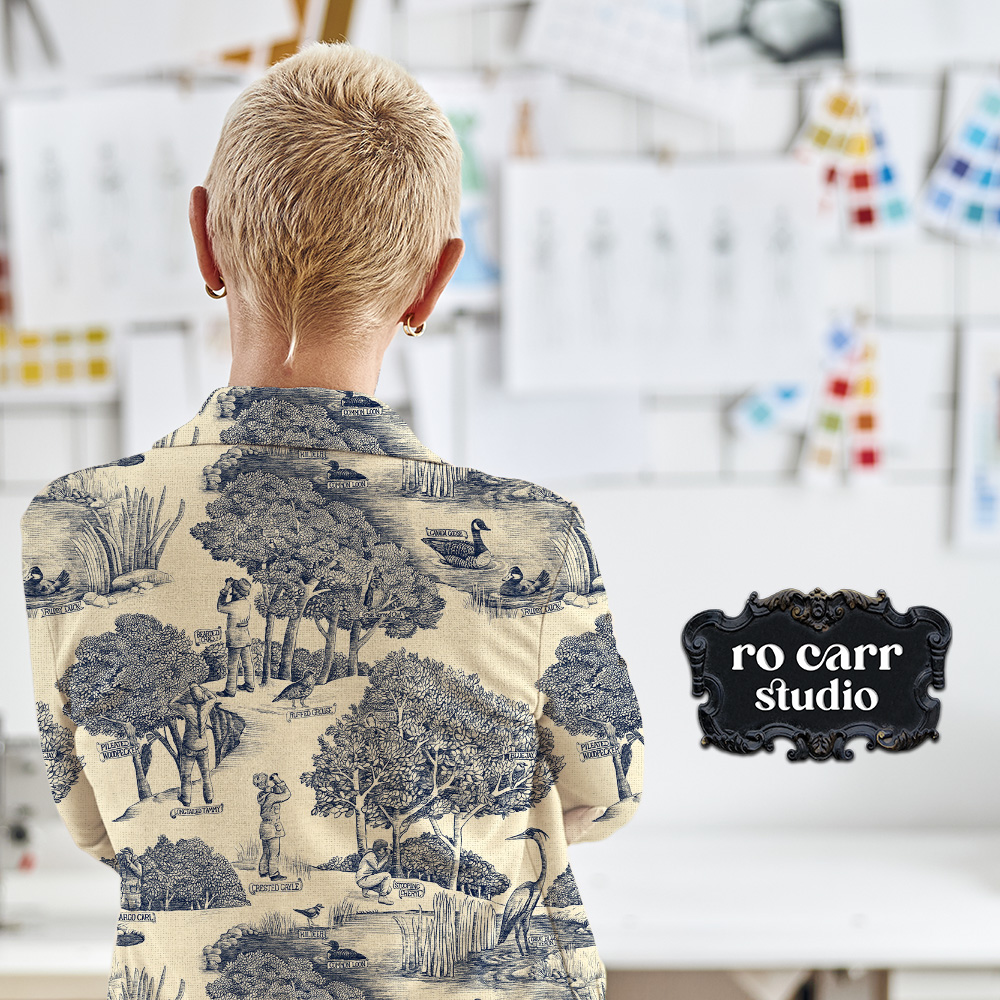Toile de Jouy pattern with a birdwatching theme, mocked up as a denim jacket worn by an artistic woman.