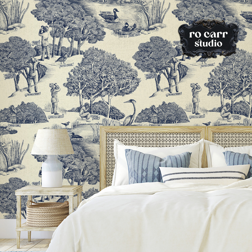 Toile de Jouy pattern with a birdwatching theme, shown in this mockup as wallpaper in a bedroom.