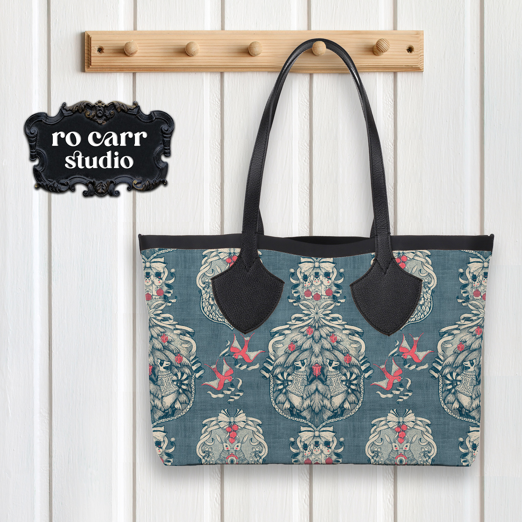 Tote bag hanging on a peg, created using the toile fabric.
