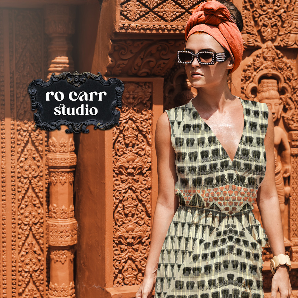 Woman in a turban and sunglasses wearing a sleeveless dress printed with the Armadillo pattern.