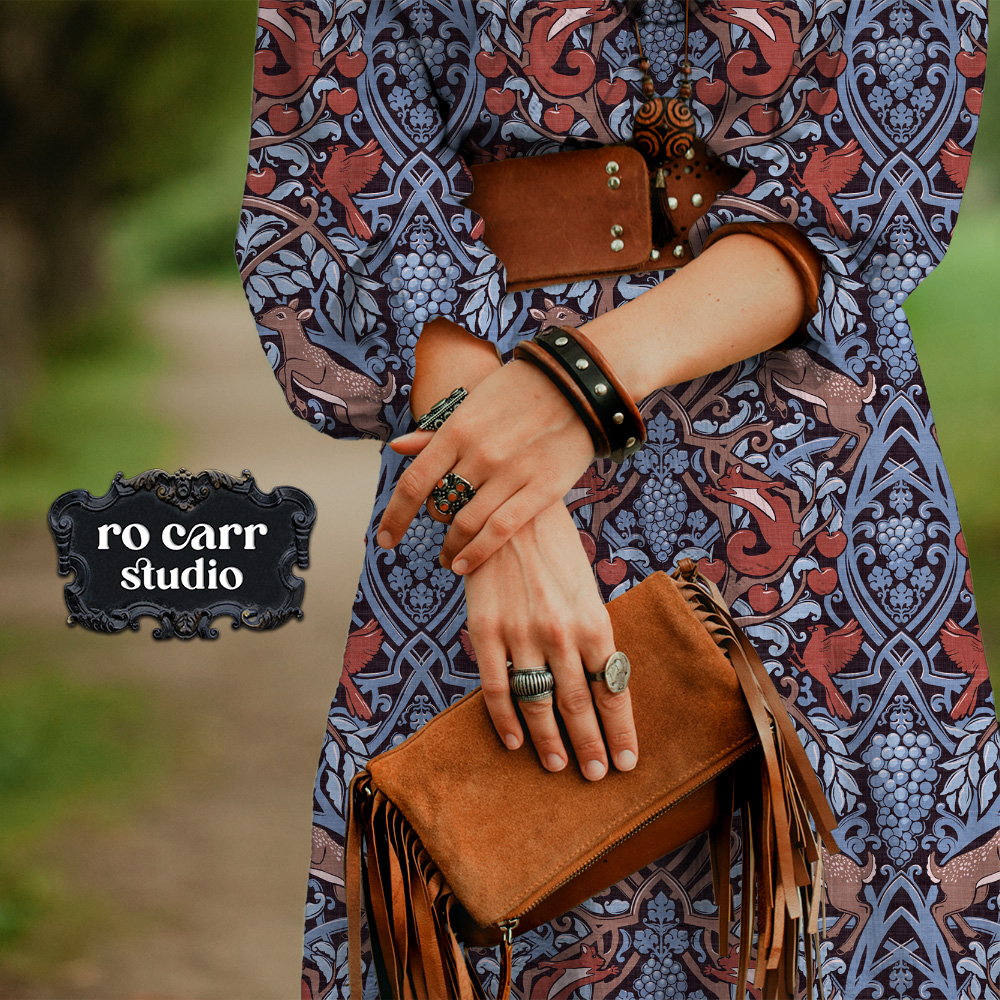 Mockup of a boho-styled woman in dress with a belt and fringed bag - the dress features the pattern.
