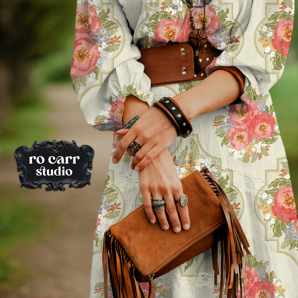 Granny Flair pattern shown as wallpaper in a bedroom with light colored furniture.