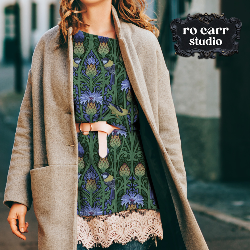 Nouveau pattern mocked up as a casual boho sweater worn by a woman walking outdoors.