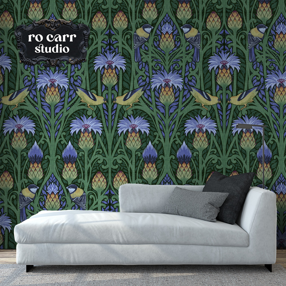 Nouveau blue repeating pattern mocked up as wallpaper with a gray chaise lounge in the foreground.