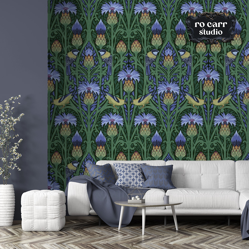 Nouveau blue repeating pattern mocked up as wallpaper with a gray chaise lounge in the foreground.