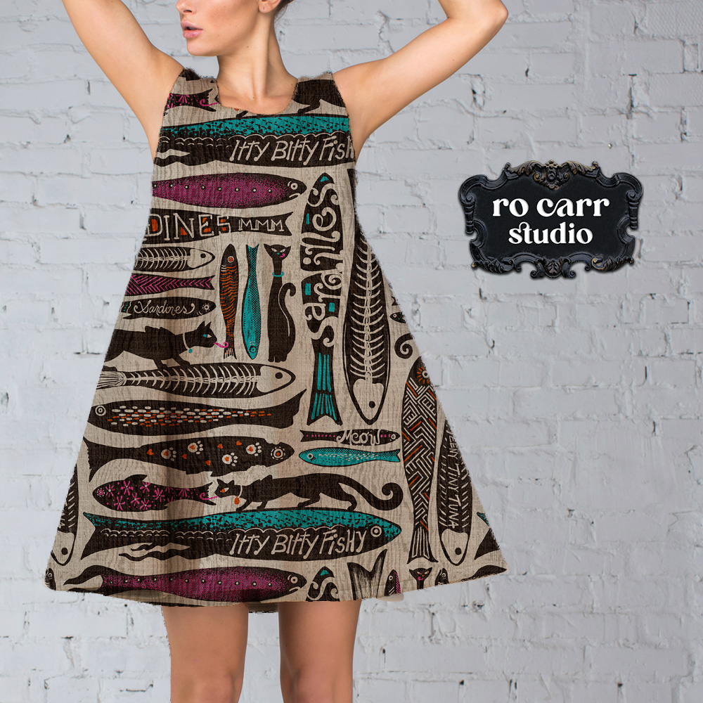 Young woman wearing a trapeze style dress printd with the Catch of the Day seamless pattern.