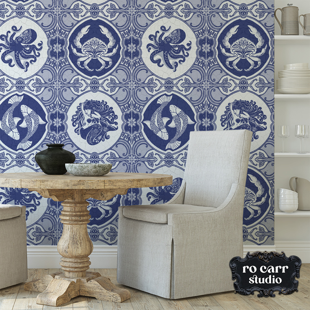 Stylish dining room with light colored furniture and covered chair, featuring dubbel dutch wallpaper.