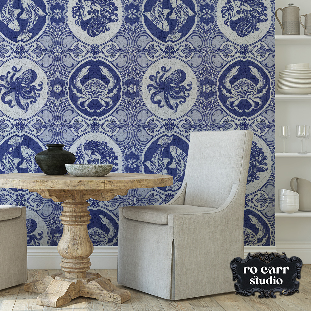 Stylish dining room with light colored furniture and covered chair, featuring dubbel dutch wallpaper.