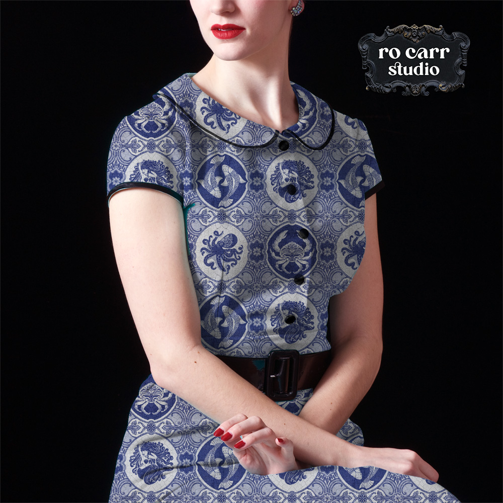 Woman wearing 50s era vintage dress, made from the dubbel dutch printed fabric.