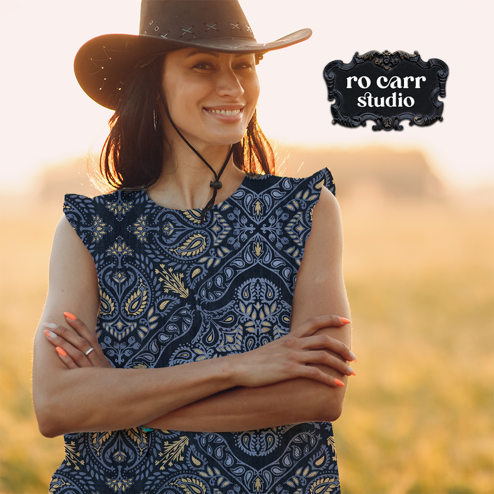 Woman wearing a sleeveless dress featuring the Retro Country Bandana pattern outdoors.