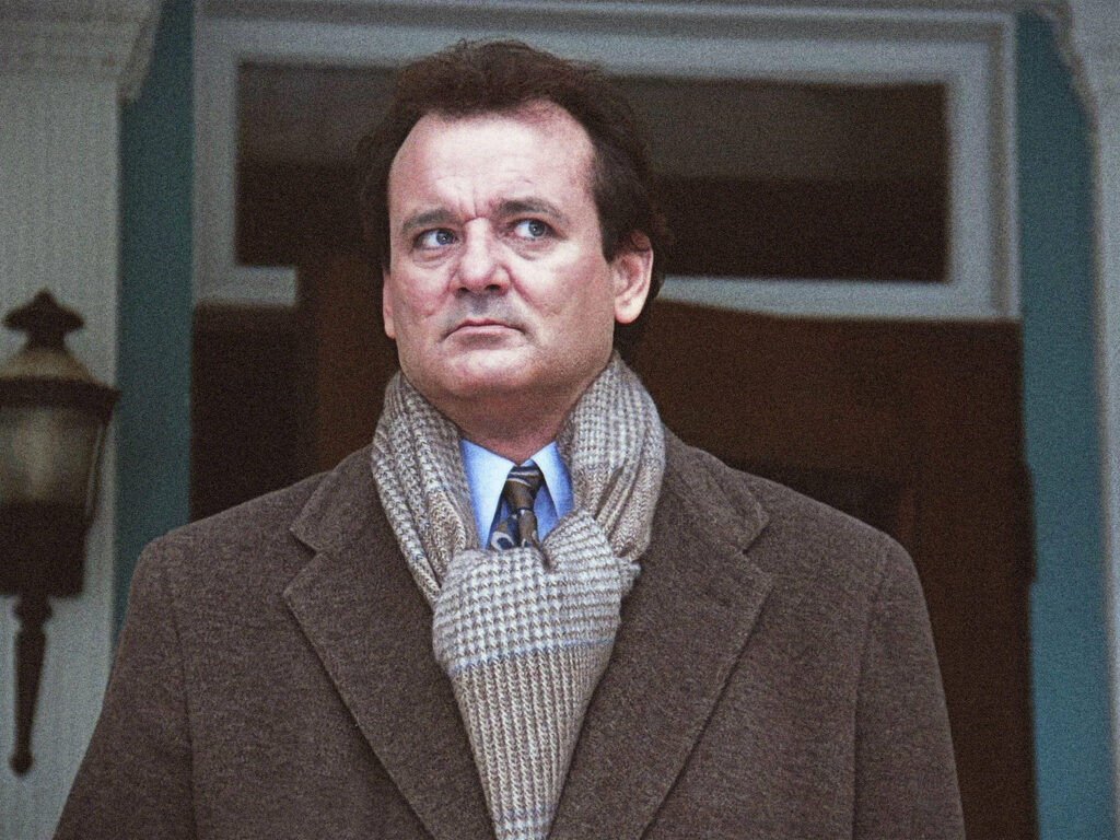 Still from the movie Groundhog Day, featuring Bill Murray standing outside, looking freaked out.