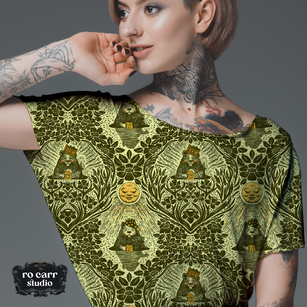Young tattooed woman wearing tee shirt printed with the olive colorway.