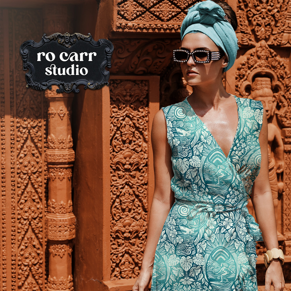 The design on a cool wrap dress and head wrap, worn against ornate stone architecture.