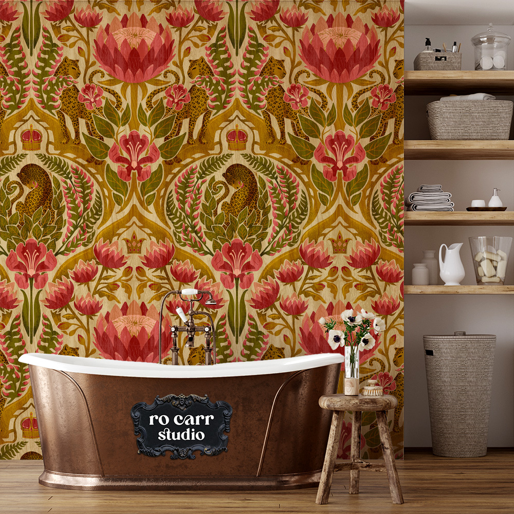 A damask leopard and tropical floral pattern in antique gold, olive green, and rose red shown as wallpaper in a bathroom with a copper clawfoot tub.