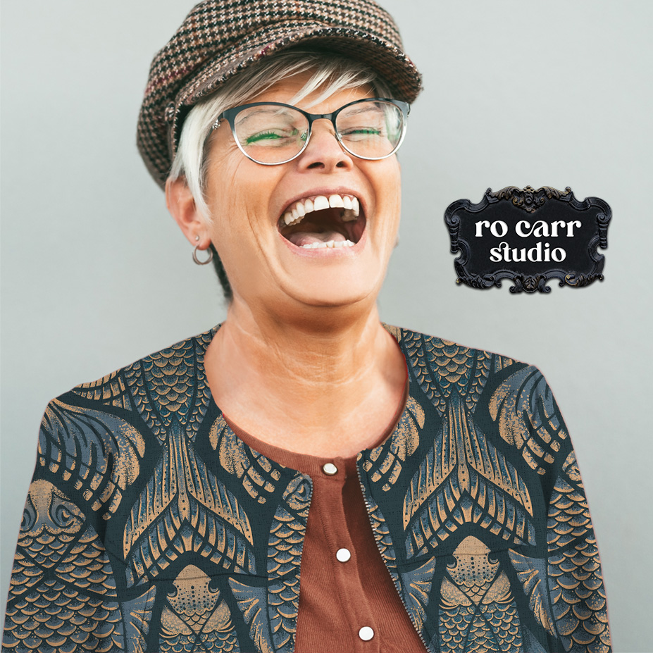 Woman laughing, wearing a tailored jacket in The Real McKoi pattern.