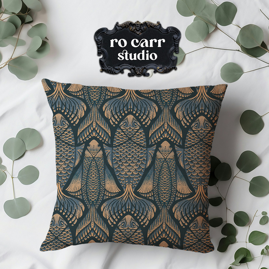 Throw pillow in the pattern styled with eucalyptus on a light surface.