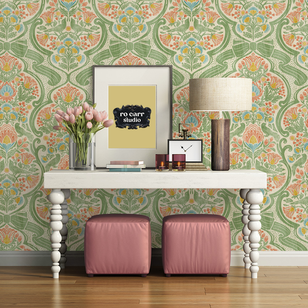 Entryway with console table and pink ottomans against a wall papered in a repeating botanical chintz pattern.