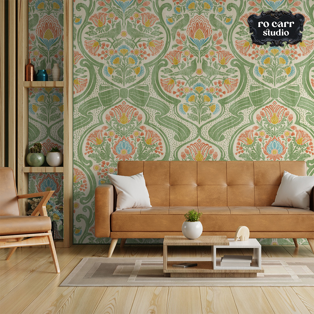 Modern living room with a tan sofa against a wall of richly patterned botanical wallpaper in warm tones.