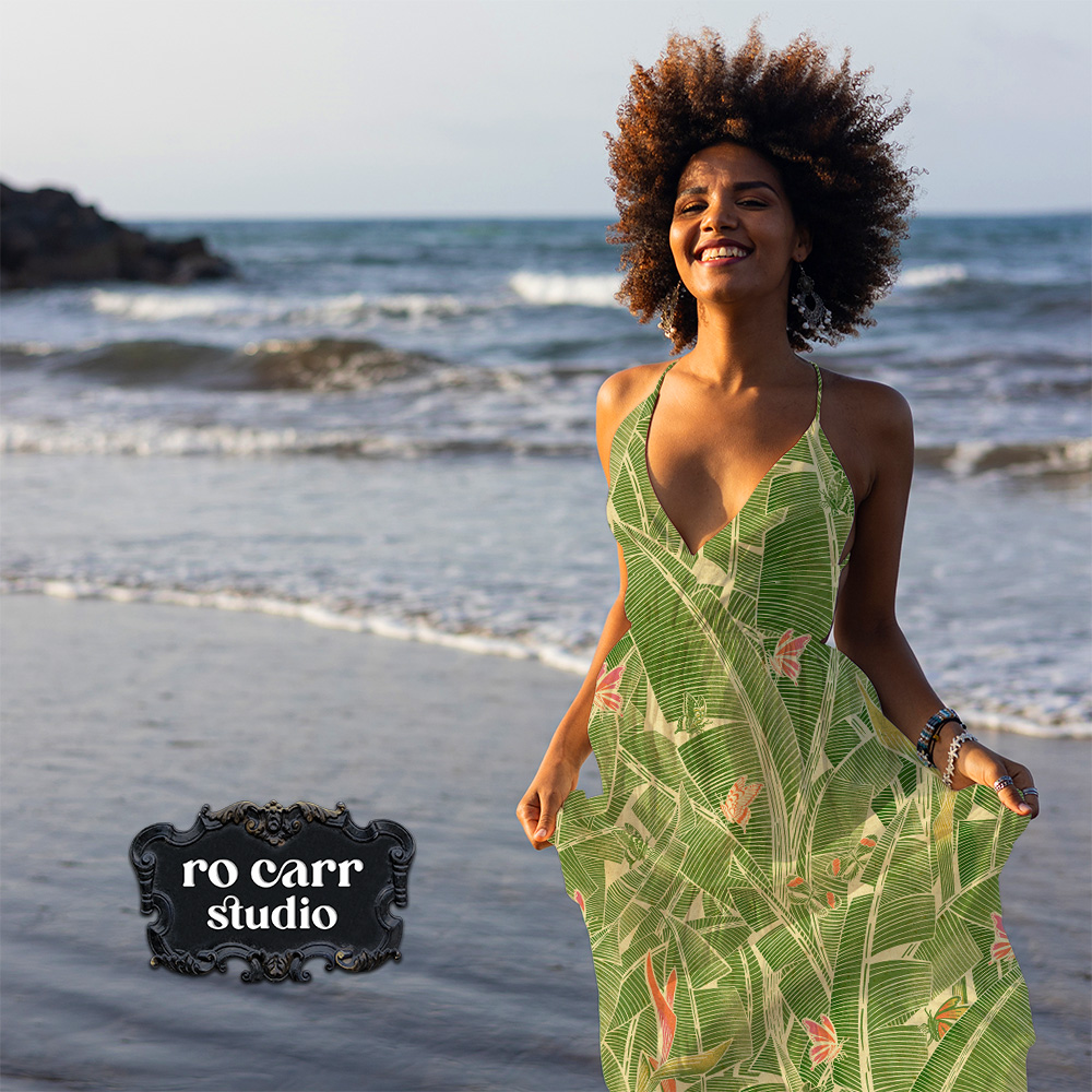 Woman in a Goodnight Jungle slip dress walking on a beach.