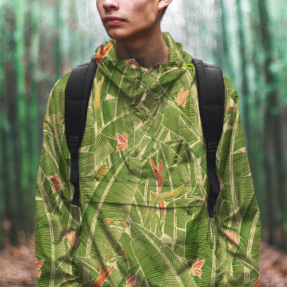 Young man wearing a Goodnight Jungle hooded jacket in a bamboo forest.