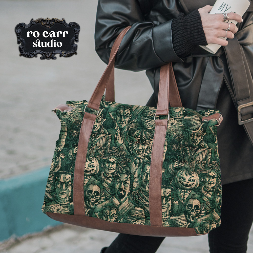 Large canvas tote with leather handles printed in Cursed Teal monster print.