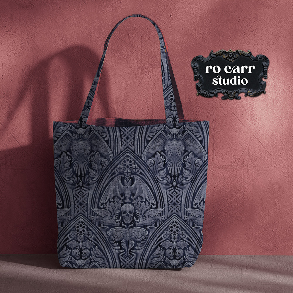 Tote bag against a dusty rose wall.